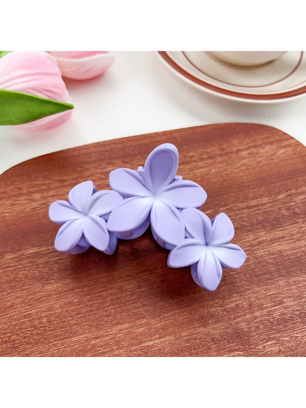 Beau Sweet Three Flower Hair Claw Clip styled in model's hair from side angle