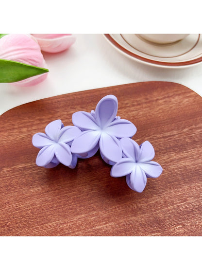 Beau Sweet Three Flower Hair Claw Clip styled in model's hair from side angle