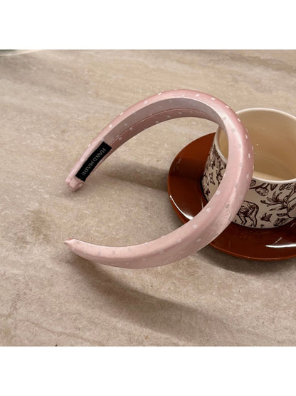 Headband displayed flat to show full length and pattern detail