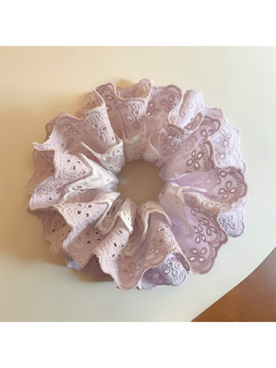 Purple double scrunchie displayed flat to show full cutout design
