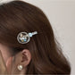 Beau hair clip displayed on a white background highlighting its elegant design