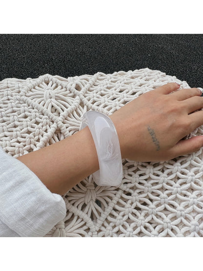 Lovra bangle bracelet displayed on a hand with natural lighting to show texture