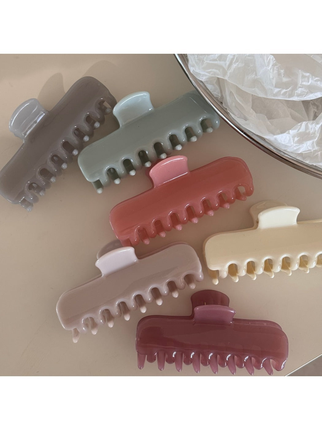 Beau hair clip showcasing vibrant multicolor petals on white background