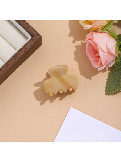 Beau vibrant acetate hair clip worn in styled hair with natural lighting