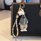 Giraffe charm keychain displayed on a white background