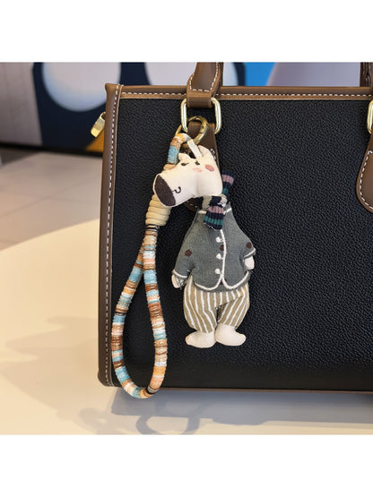 Giraffe charm keychain displayed on a white background