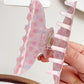 Beau Sweet Pink Floral Print Hair Claw Clip holding hair in a half-up style