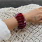 Lovra red ombre link bracelet and ring styled with casual outfit on model