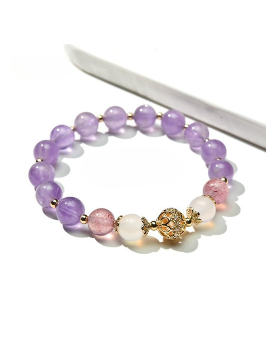 Close-up of Lovra vintage purple beaded bracelet with round and faceted beads