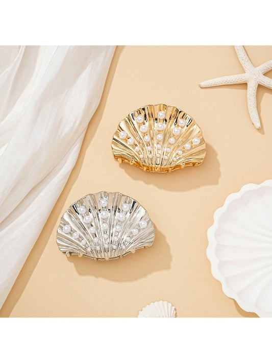 Beau ocean themed hair clip shaped like a seashell with blue and white accents