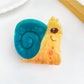 Beau hair claw clip shaped like a bear shown from top view