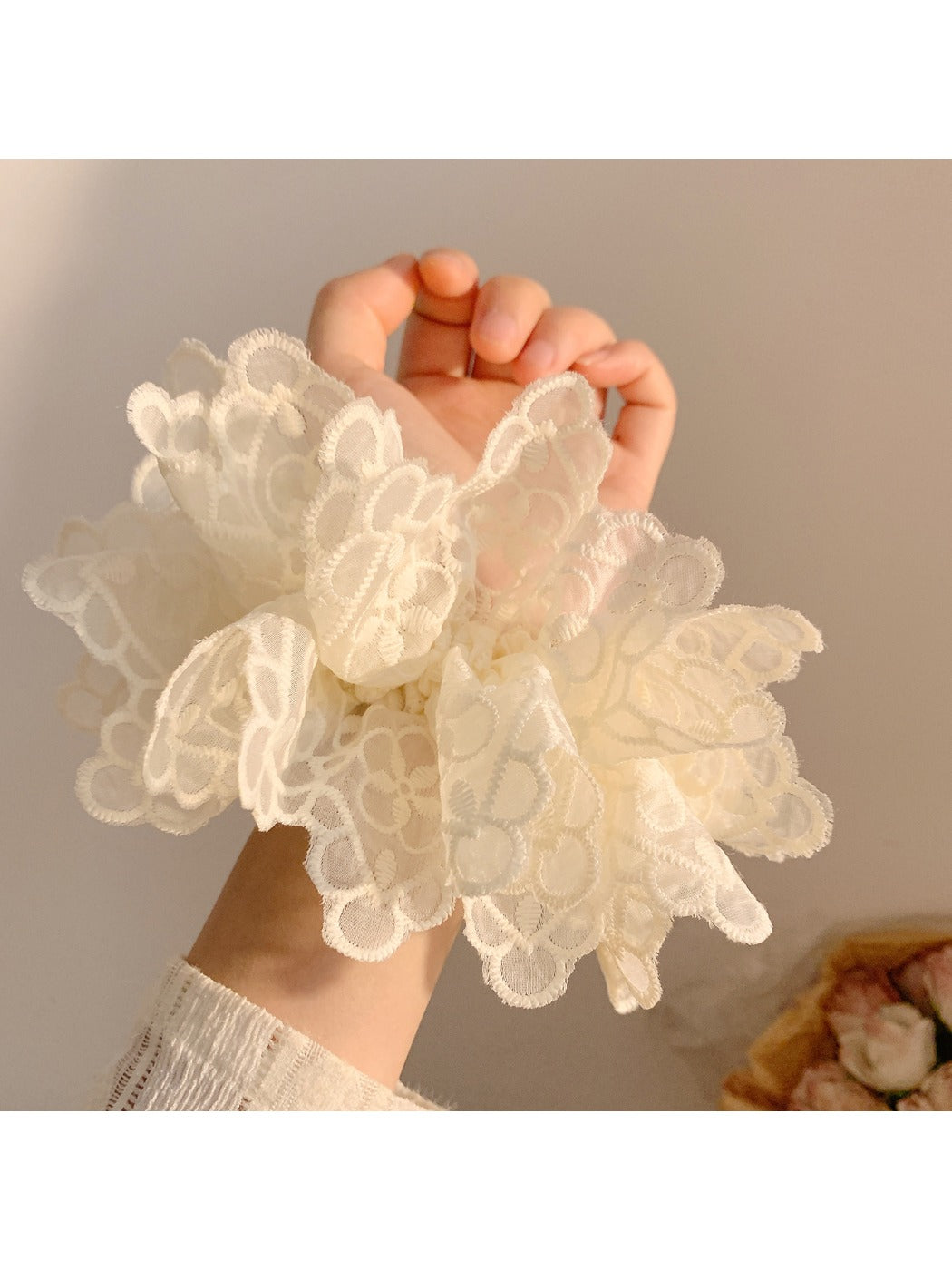 Close-up of white double layer scrunchie showing fabric texture and layers