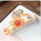 Top view of Beau colorful flower pattern hair clip with glossy finish