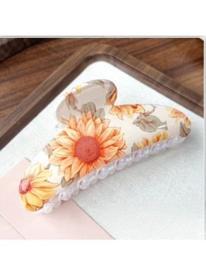 Top view of Beau colorful flower pattern hair clip with glossy finish