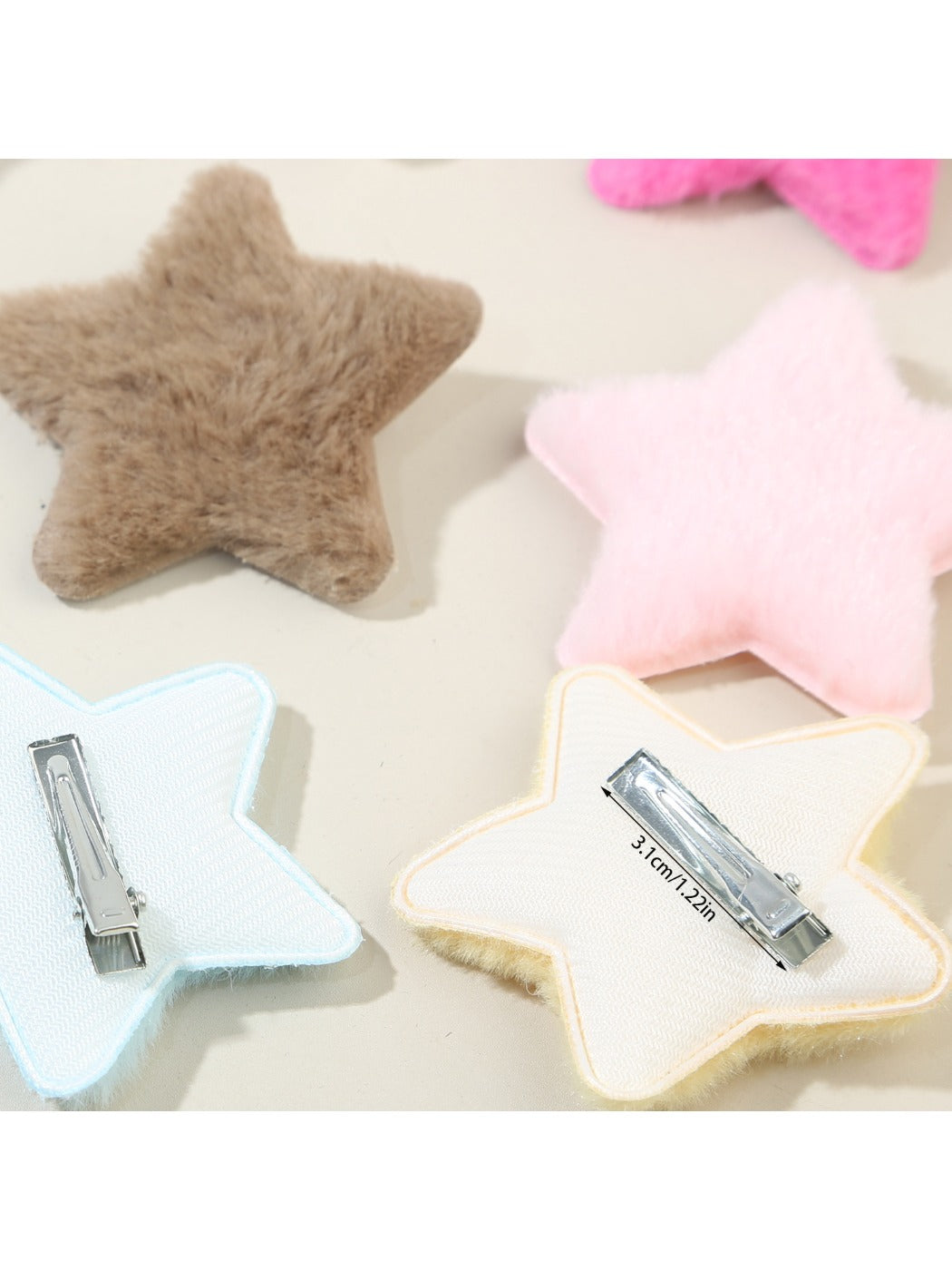 Beau star hair clip attached to a model's dark brown hair from side view