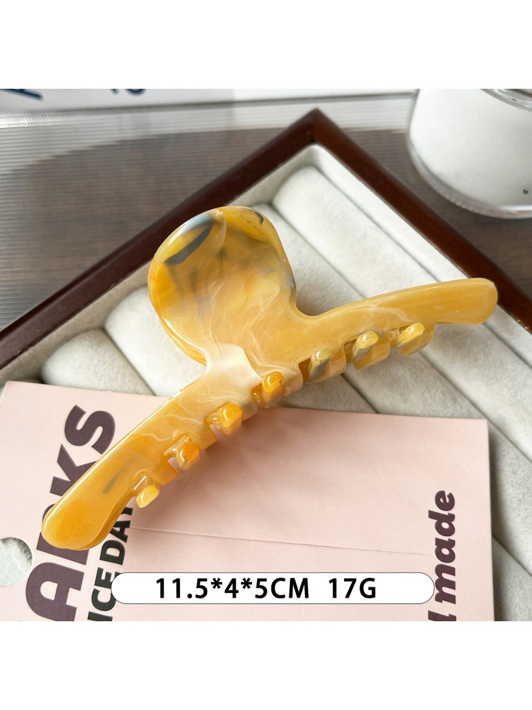 Beau large claw clip displayed next to matching hair accessories