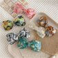 Beau - Marbled Acetate Bow Spring Hair Clip