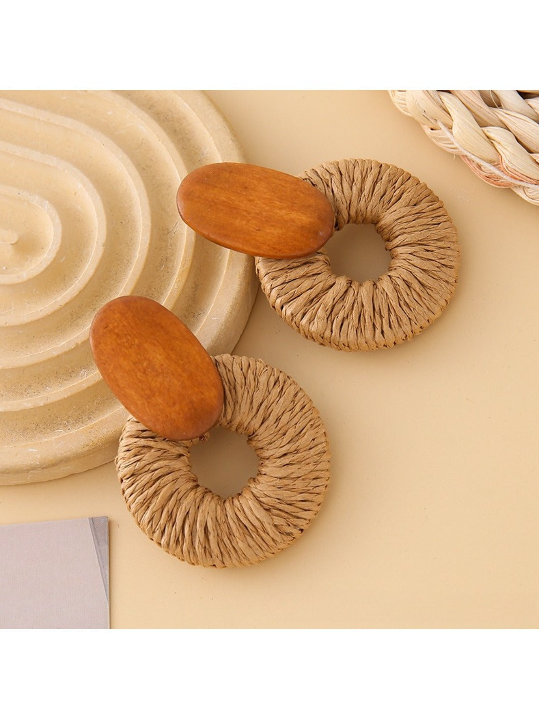 Side view of Earedge round drop earrings showing smooth silver surface