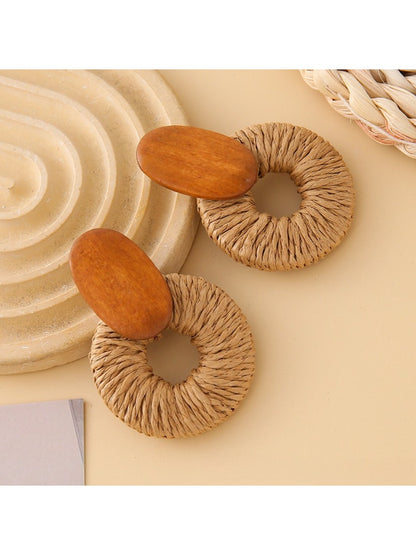 Side view of Earedge round drop earrings showing smooth silver surface