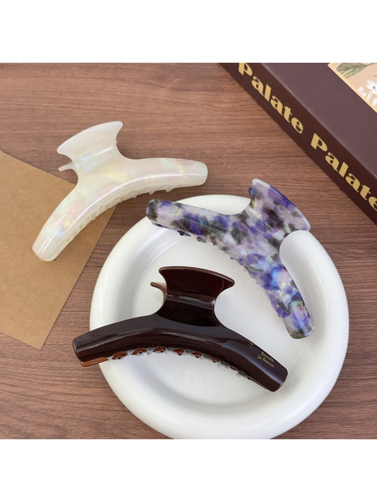 Beau acetate curved claw clip in tortoiseshell pattern, side view