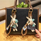 Close-up of rabbit charm keychain showing detailed facial features and ears