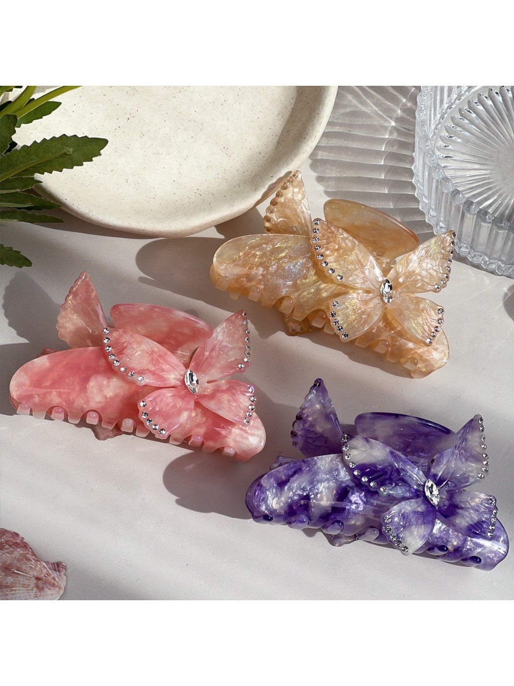 Close-up of Beau hair claw clip showing detailed colorful butterfly design