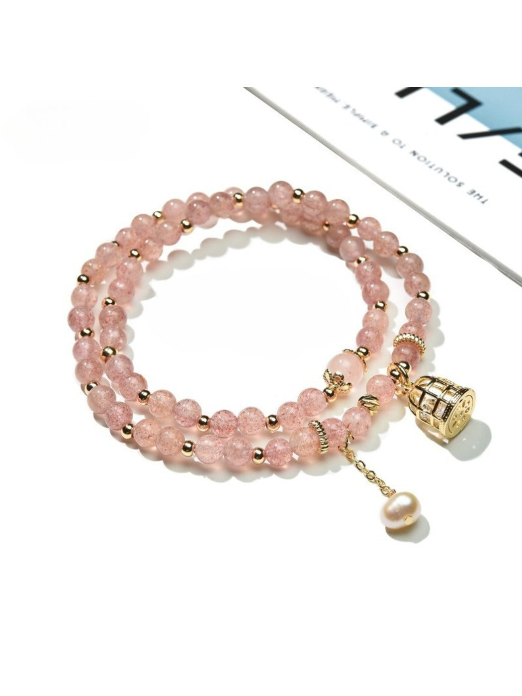 Lovra elegant bracelet with pink crystal beads and colorblock design on a white background