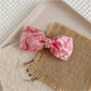 Beau - Marbled Acetate Bow Spring Hair Clip