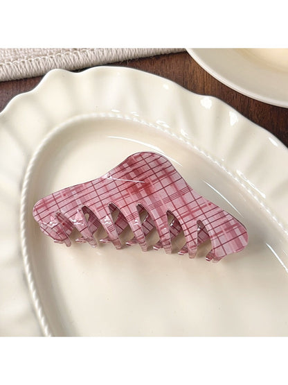 Beau pink plaid crescent claw clip clipped in long brown hair