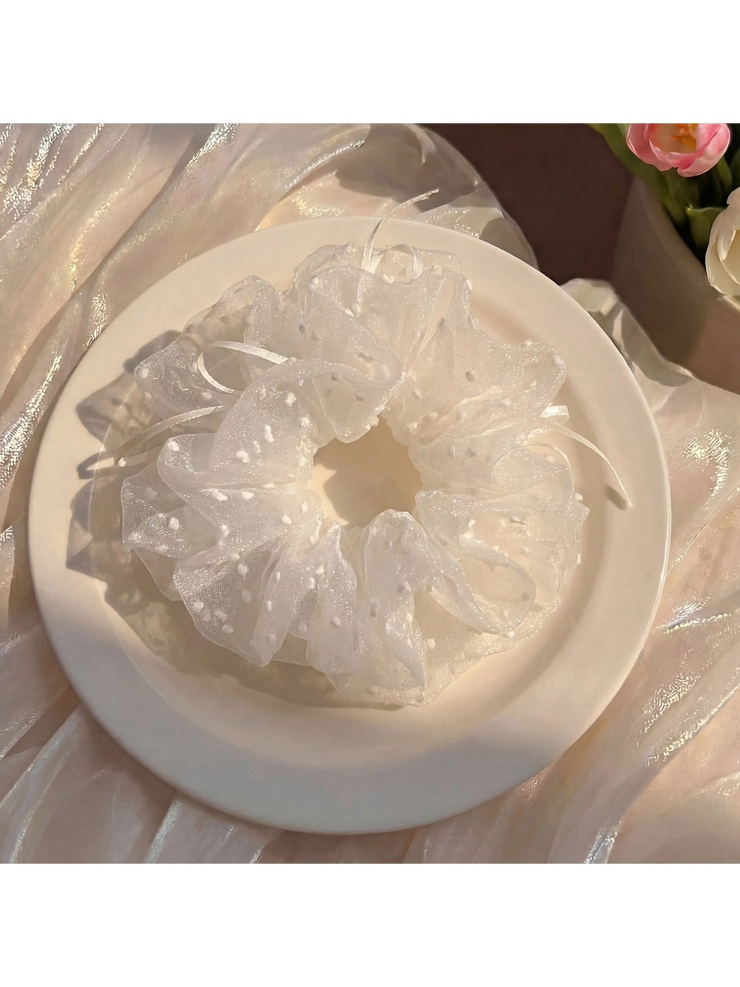 White double layer scrunchie with minimalist modern design on a plain background