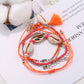 Lovra multi-row bracelet styled with casual outfit on model's arm
