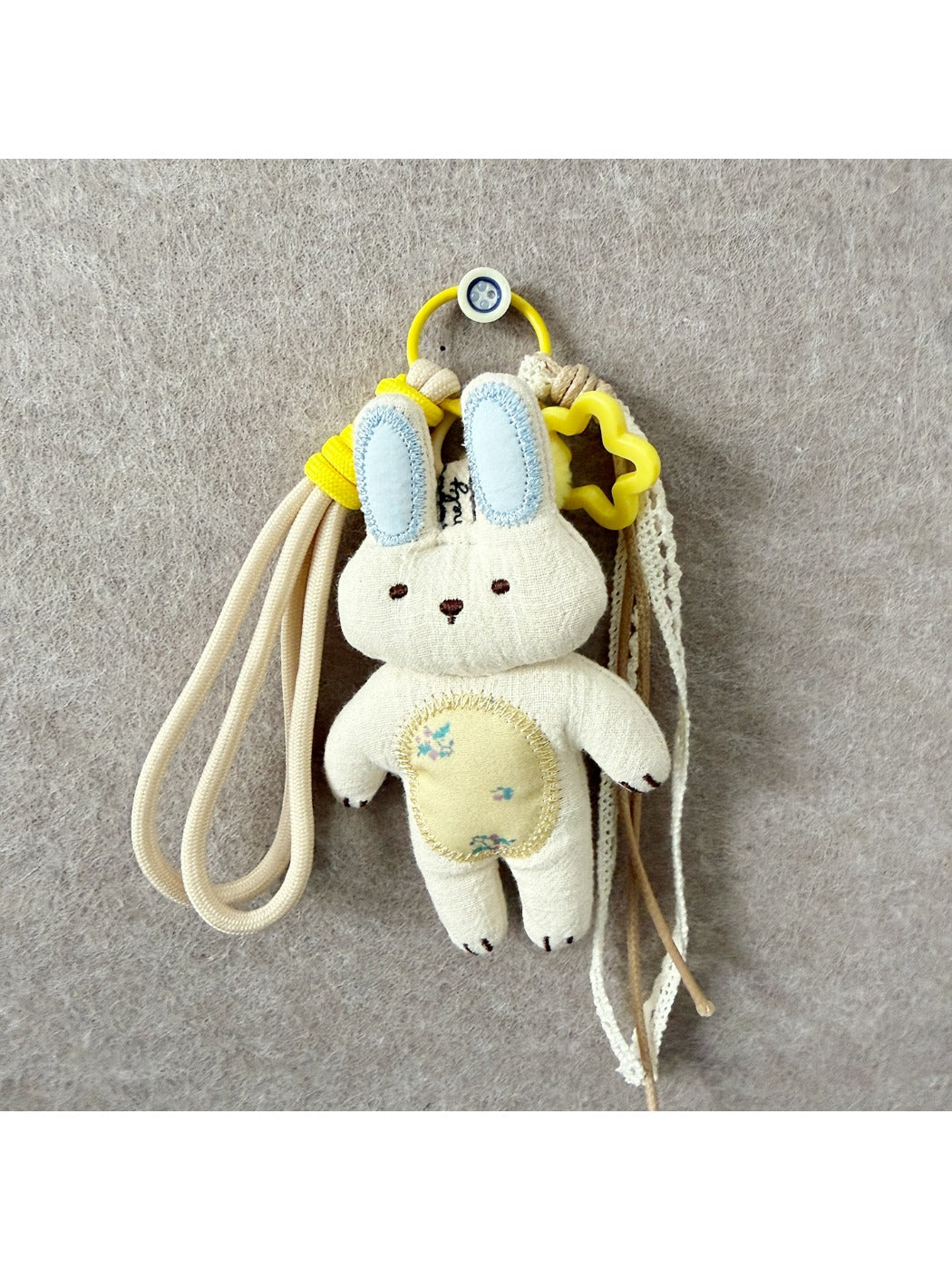 Both fabric rabbit and cat keychains displayed together on a white background