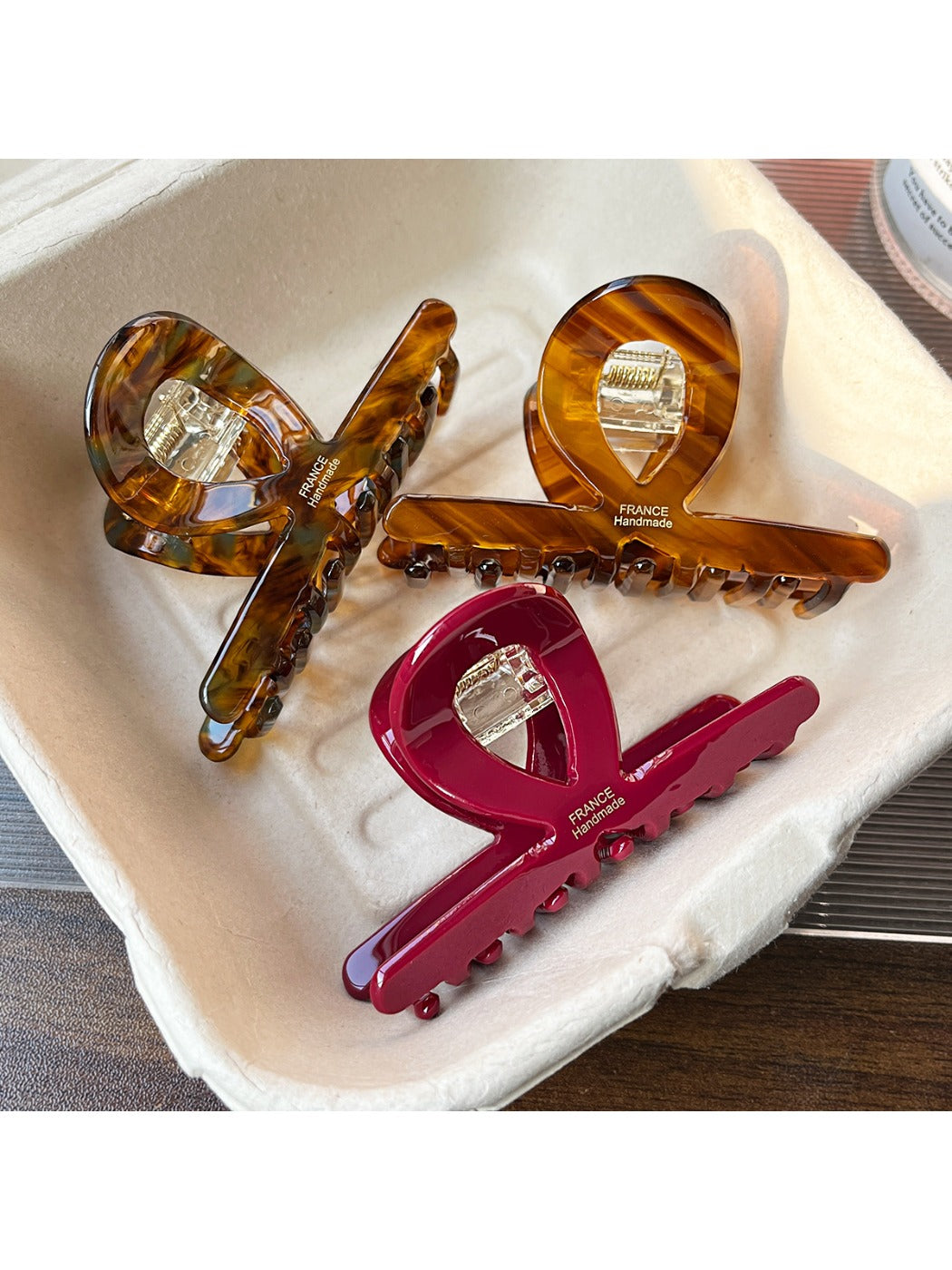 Beau acetate bar shape claw clip in tortoiseshell pattern on white background