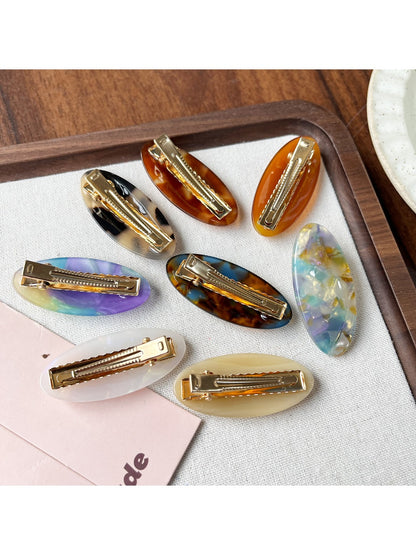 Side view of Beau Sweet Oval Acetate Hair Clip highlighting metal clasp mechanism