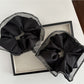 Gifty scrunchie styled on a wrist as a fashion accessory with neutral tones