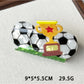 Beau claw clip featuring a soccer ball pattern with visible spring mechanism