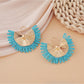 Earedge raffia woven fan shape earrings paired with casual outfit on model