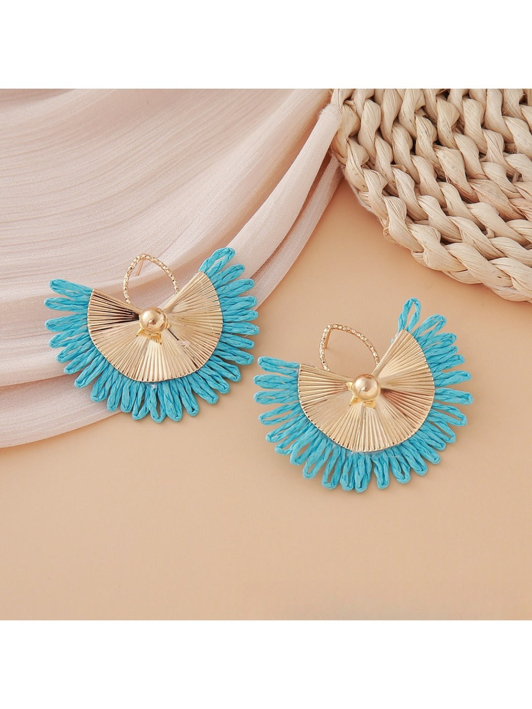 Earedge raffia woven fan shape earrings paired with casual outfit on model