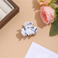 Beau vibrant acetate hair clip held in hand to show size and shape