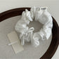 Multiple Gifty Sweet Bow Stripe Scrunchies stacked showing consistent striped design