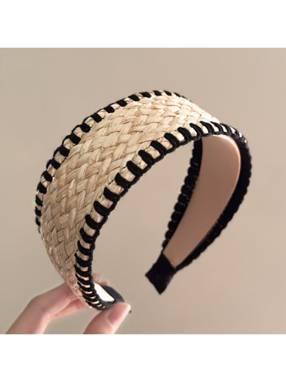Bohemian wide minimalist headband styled with casual outfit on a wooden surface