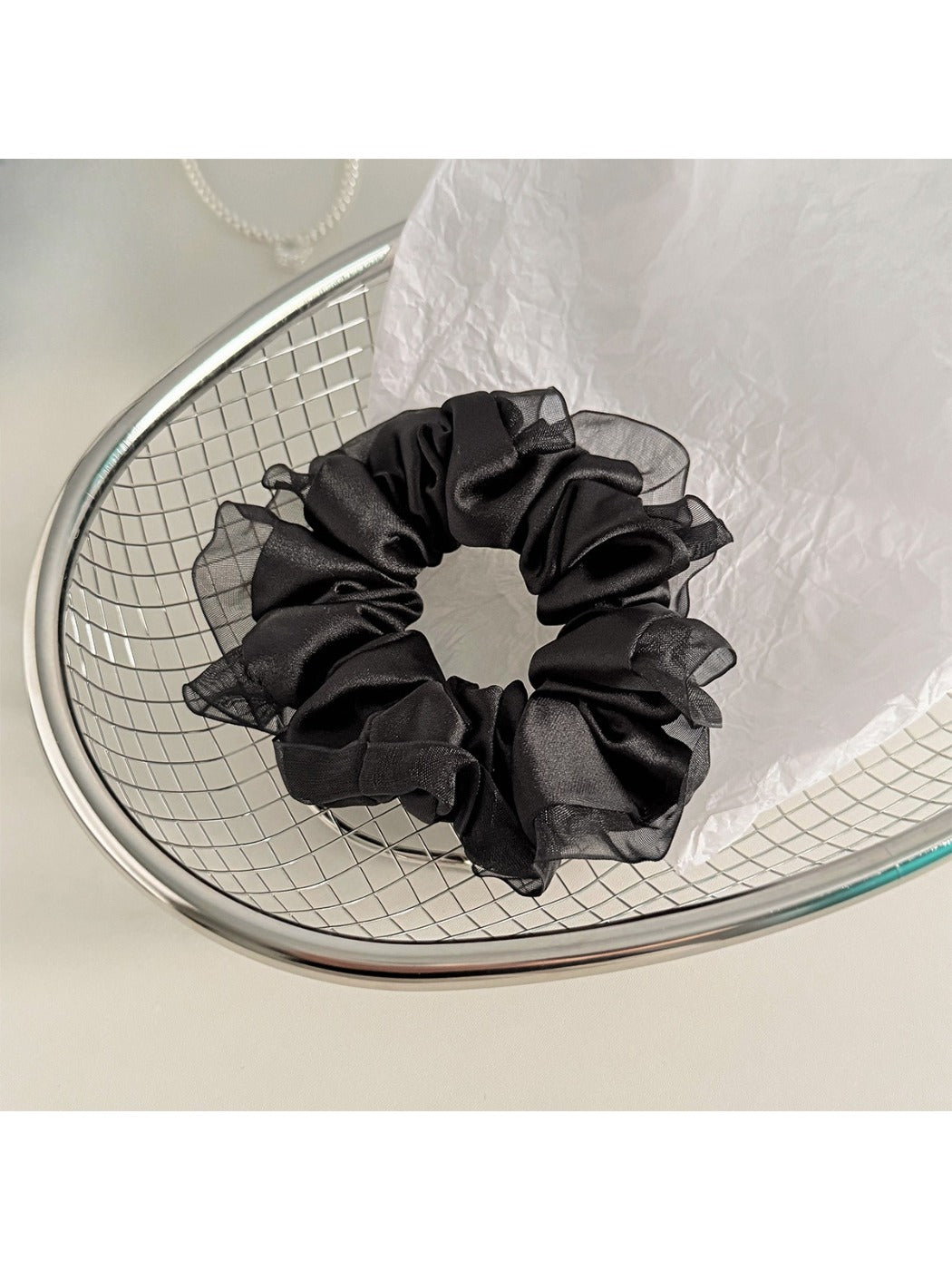 Model wearing Gifty satin tulle ruffle trim scrunchie in hair