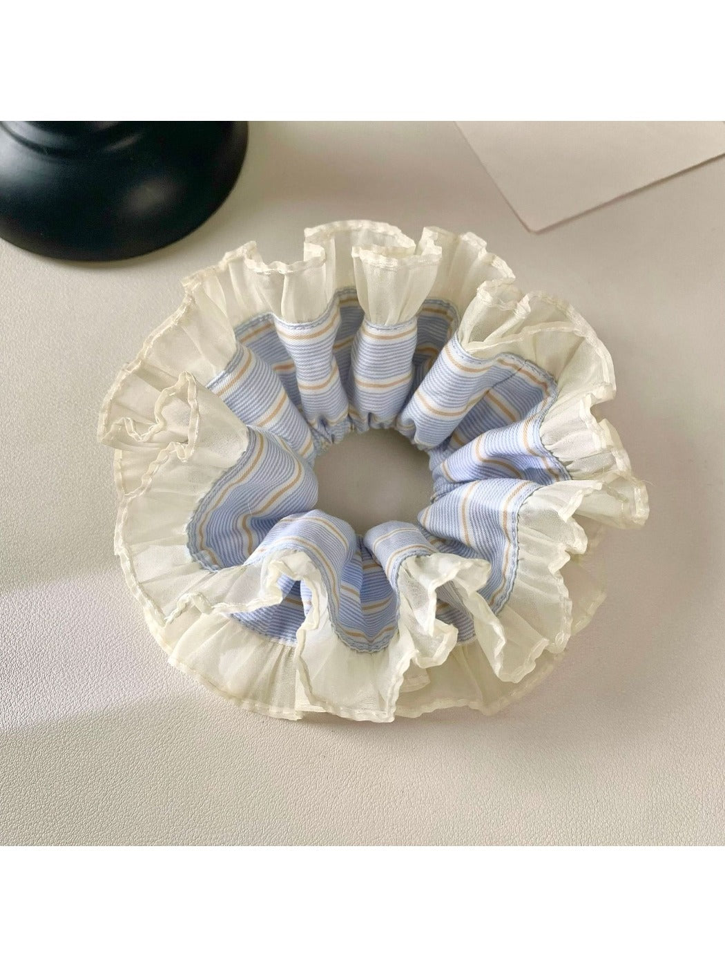 Gifty cloudy cute comfortable scrunchie in soft pastel colors on a white background