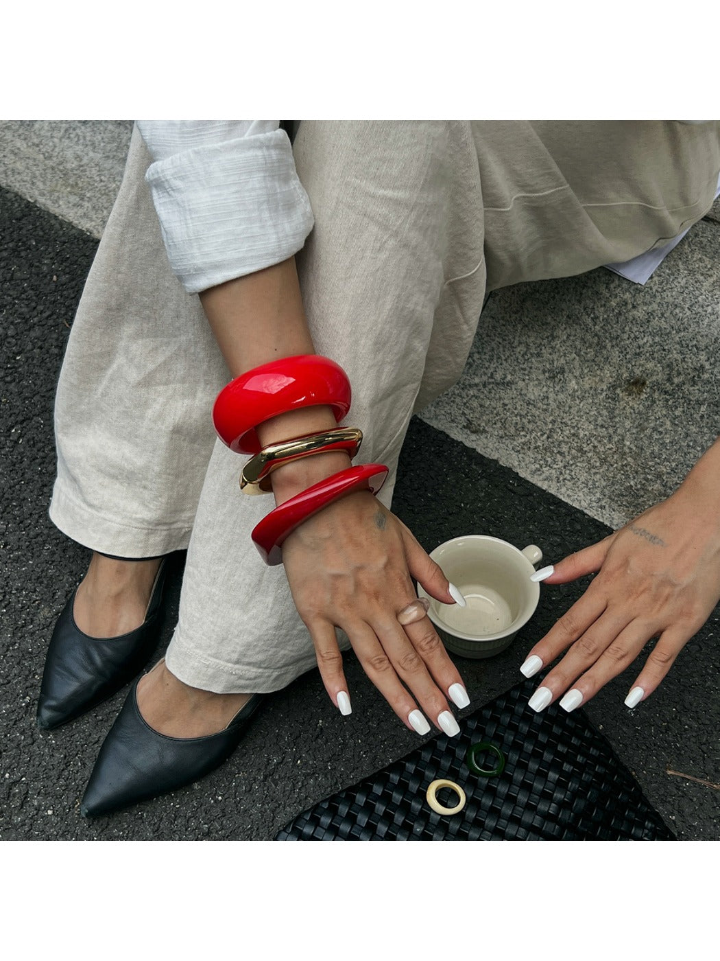 Lovra irregular bangle bracelet worn on wrist with casual outfit