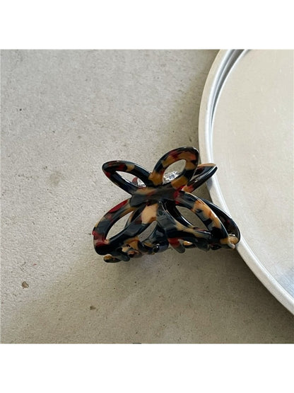 Beau Misty Acetate Butterfly Hair Clip clipped in brunette hair with natural light