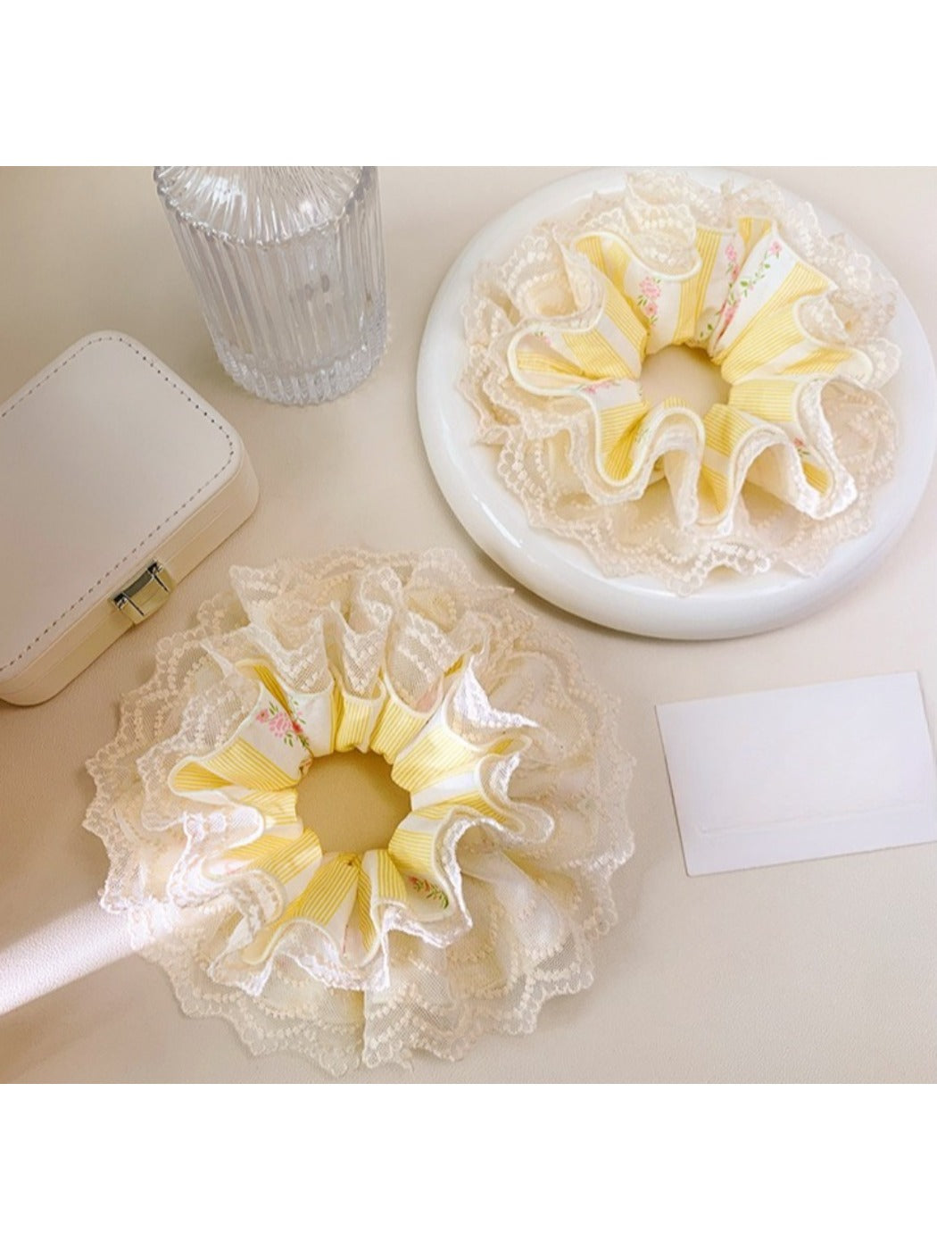 Yellow lace scrunchie styled in a ponytail on a model
