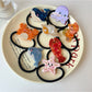Gifty Ocean World hair tie with blue ocean animal pattern on elastic band