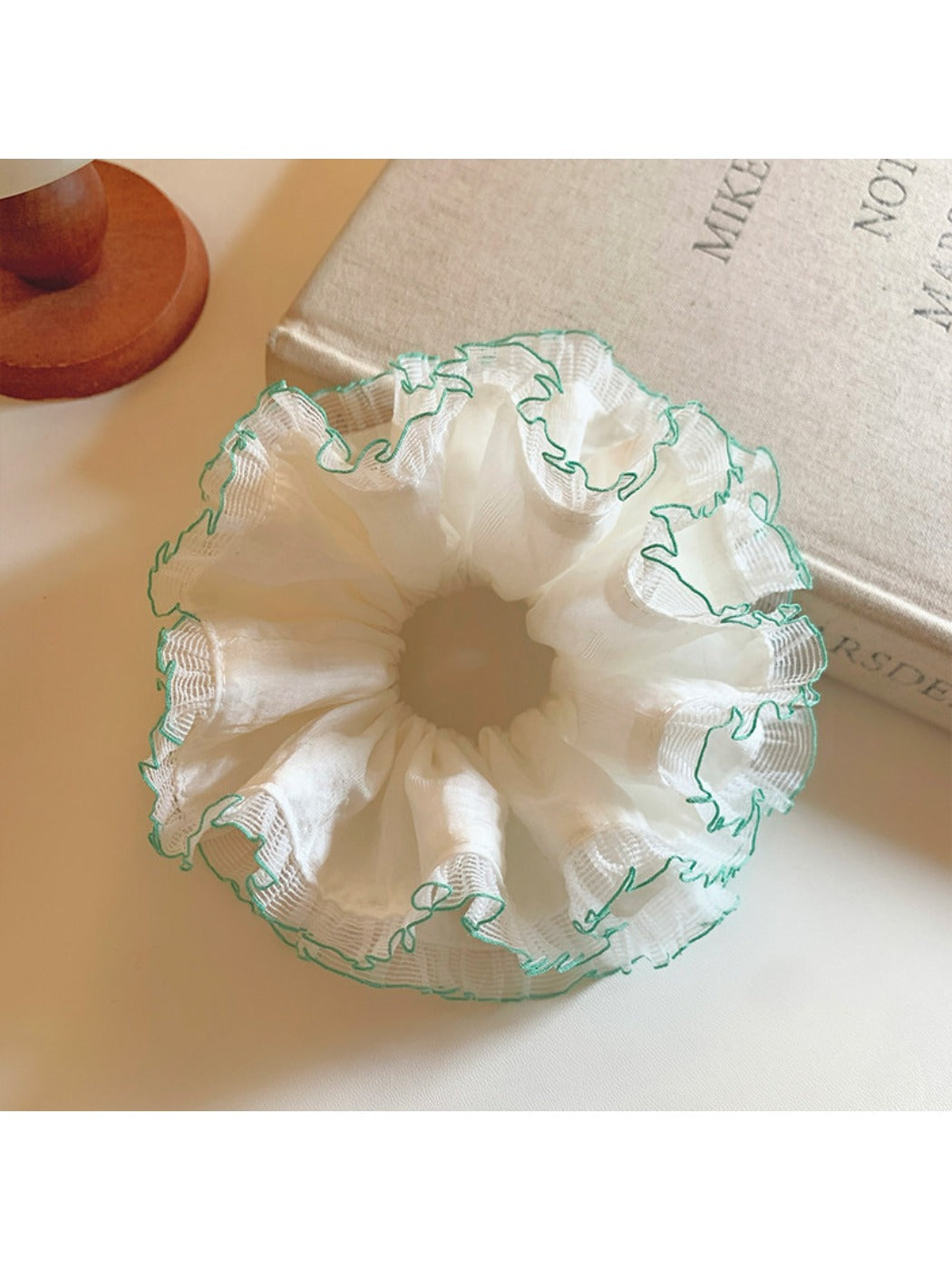 Side view of Gifty white tulle double scrunchie with green trim