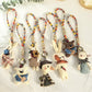Close-up of Keypus fabric cartoon doll keychain showing detailed stitching and facial features