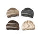Beau half circle hair clip clipped into brown hair from side view